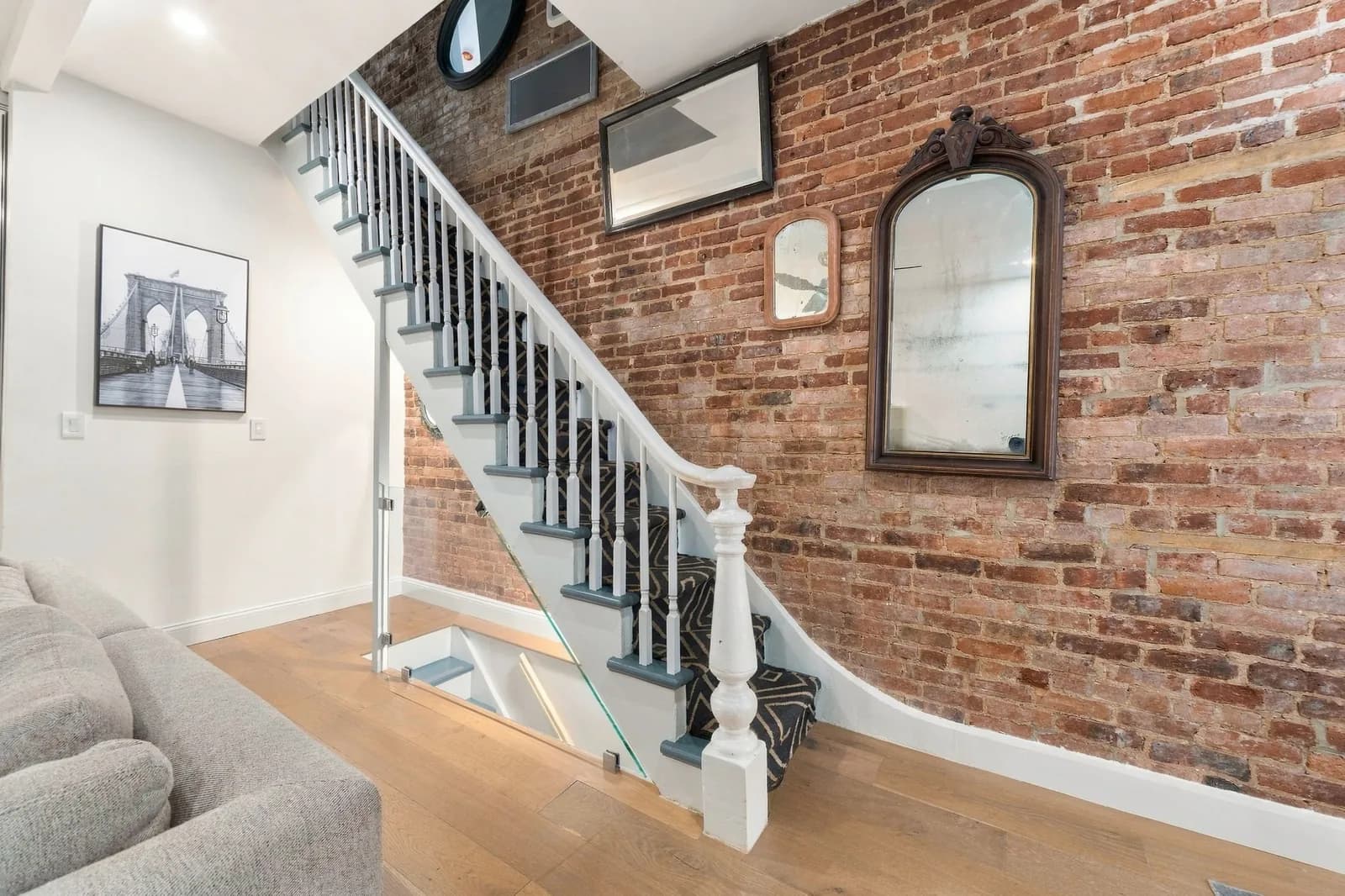 Townhouse staircase with an exposed brick wall, Bedford-Stuyvesant