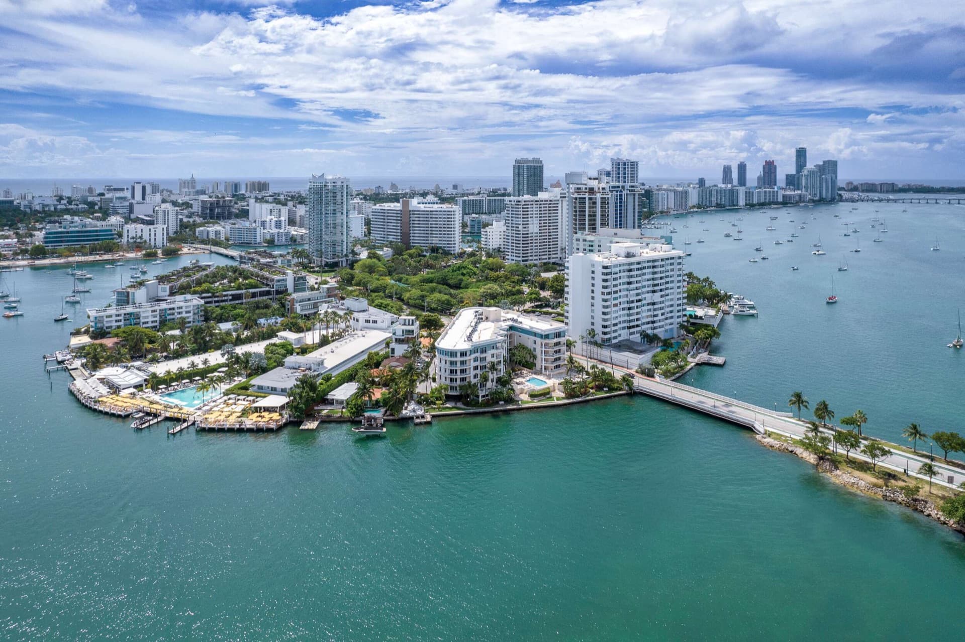Aerial view of a waterfront island with towers and a bay