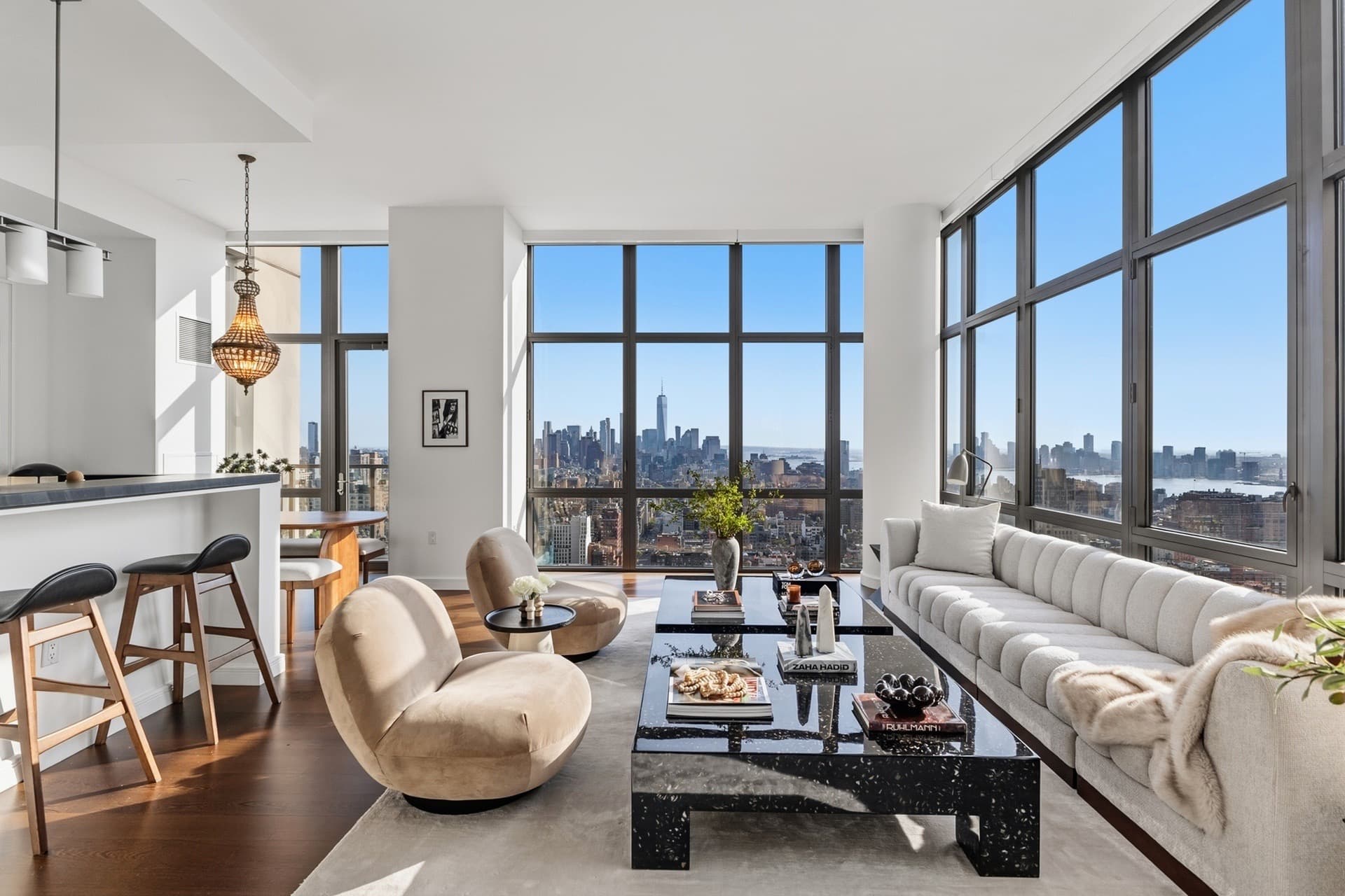 Living room with floor-to-ceiling windows and a view of the Manhattan skyline