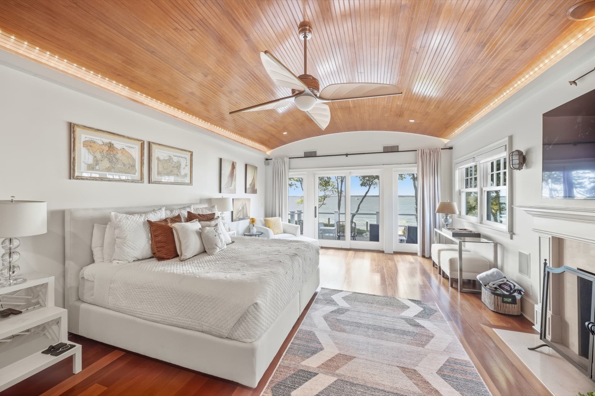 Bedroom with a wood ceiling and neutral bedding