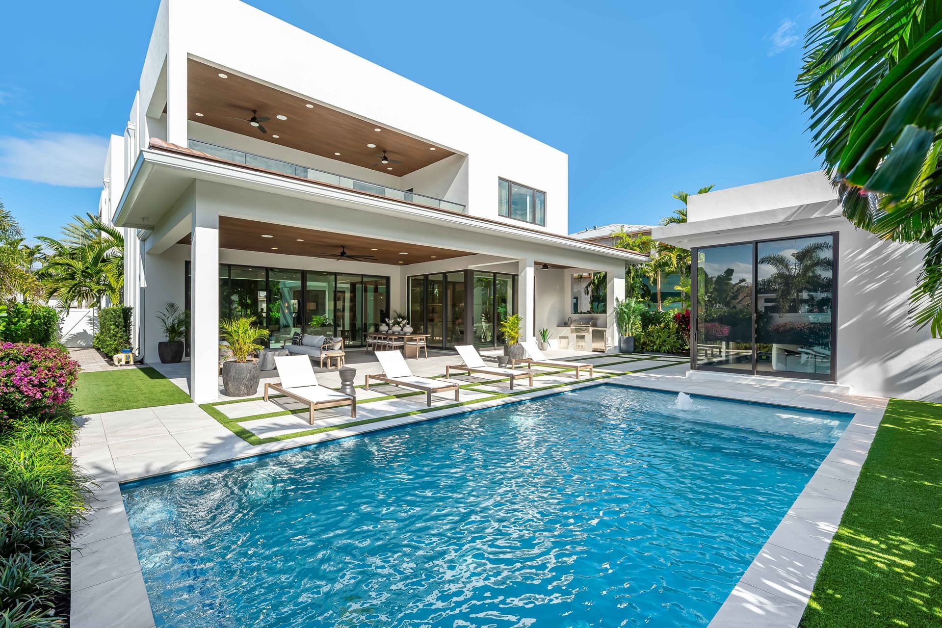 Modern white house with a covered terrace and pool